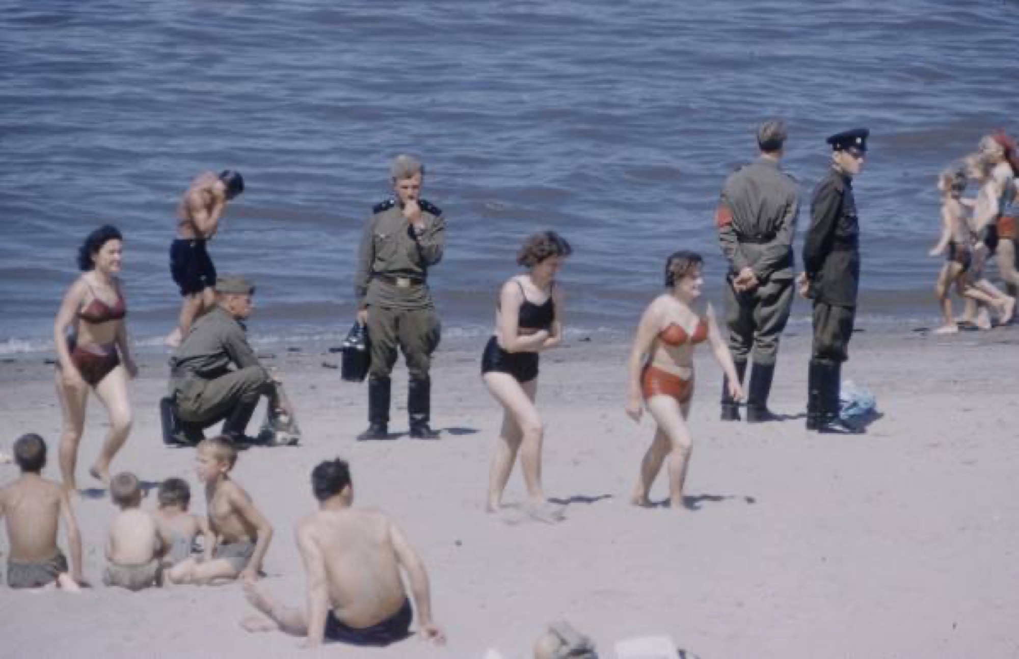 Beach on the river, servicemen and holidaymakers, 1950s